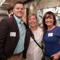 two women and man attendee